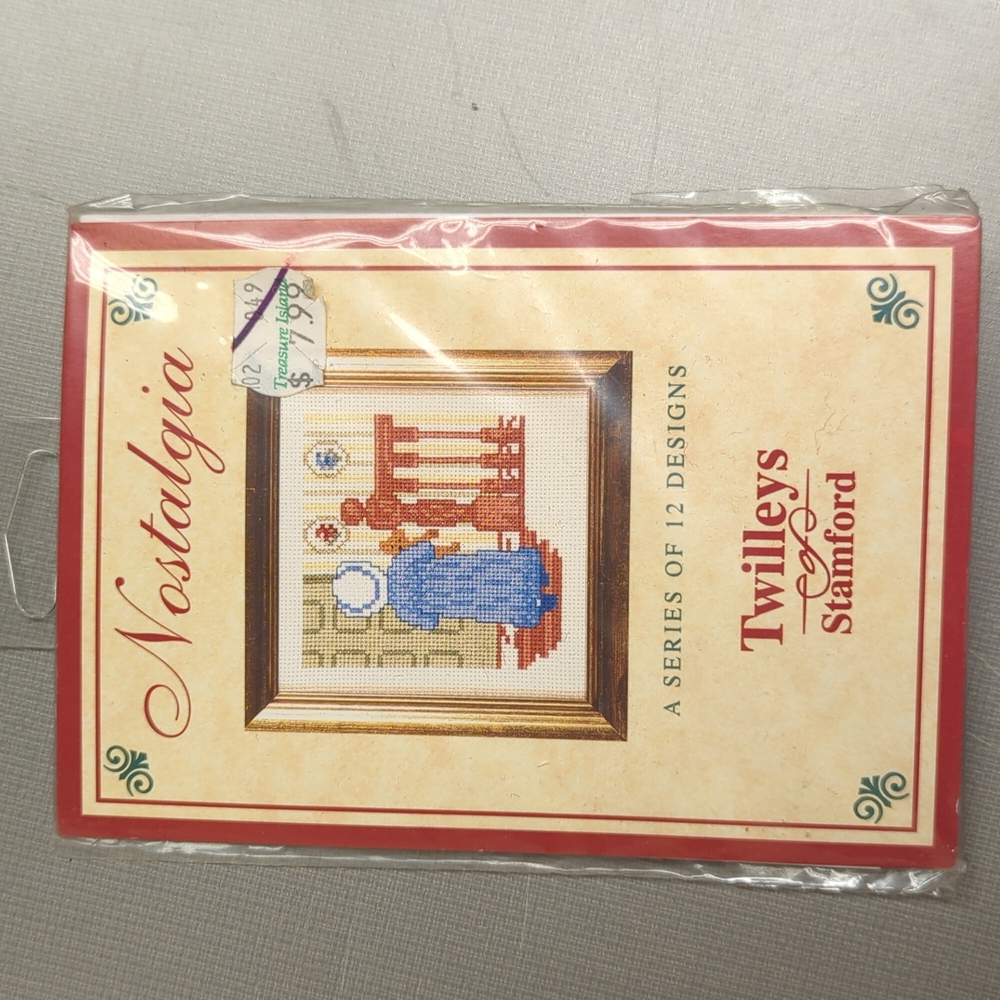 Hand Crafted counted cross kit with floss of woman with teddy bear.
